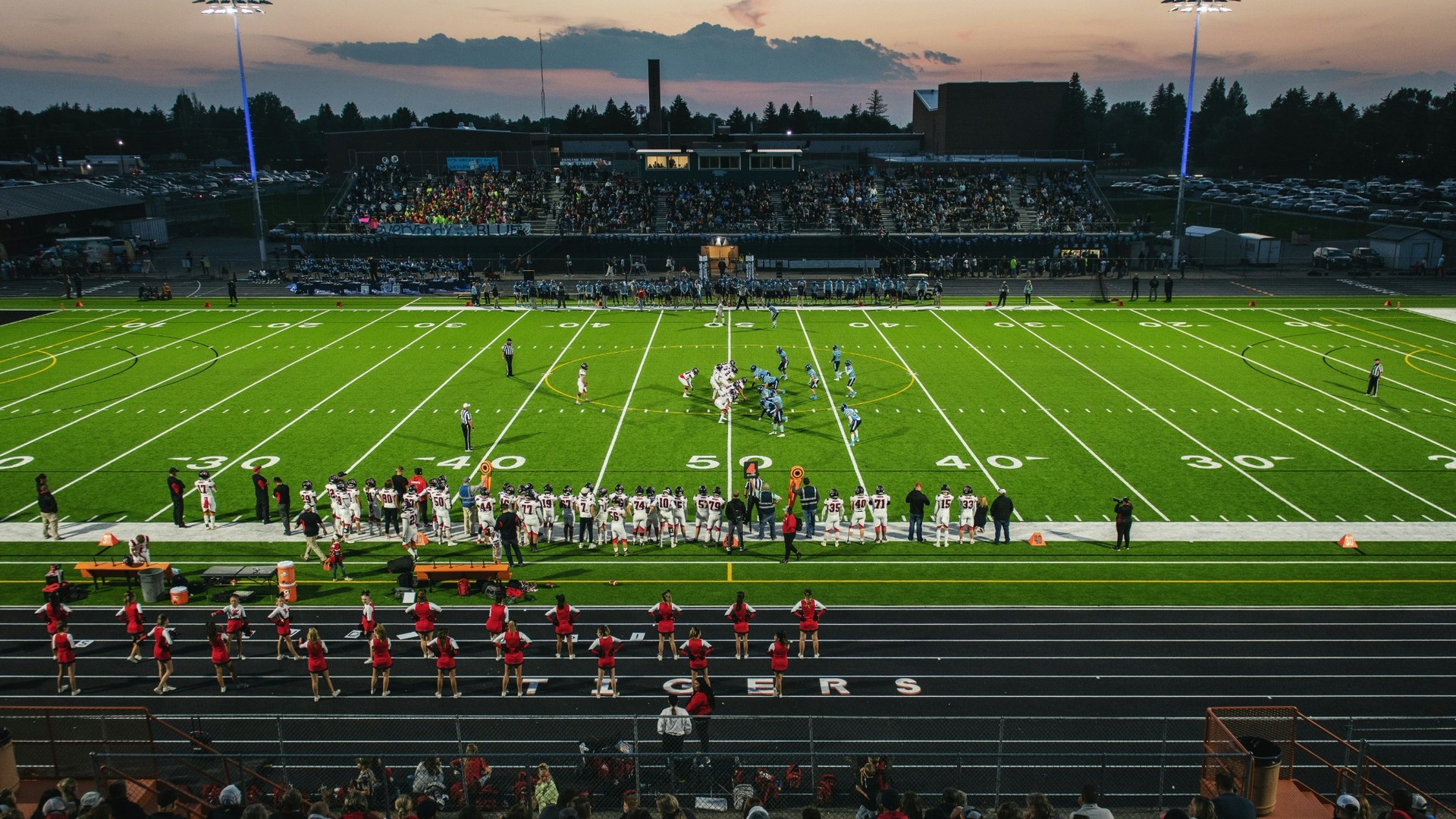 Friday night lights—football field at sunset